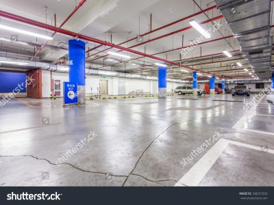 stock-photo-parking-garage-underground-interior-with-a-few-parked-cars-168237203